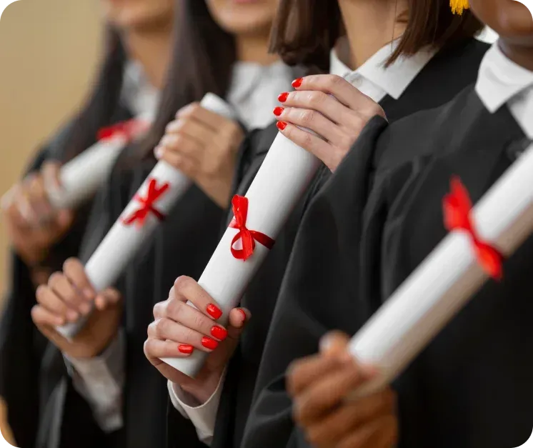 Graduates holding diplomas